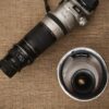 Macro lenses on display at a photography equipment exhibition.